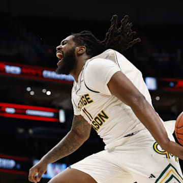 Mar 15, 2025; Washington, D.C., USA; George Mason Patriots forward Jalen Haynes (11) celebrates after dinking the ball in the closing seconds against the Saint Joseph's Hawks in the second half at Capital One Arena. Mandatory Credit: Geoff Burke-Imagn Images