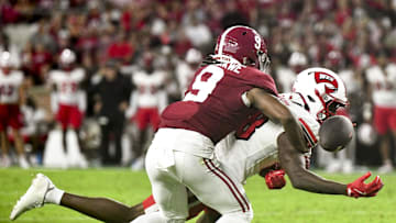 Aug 31, 2024; Tuscaloosa, Alabama, USA;  Alabama Crimson Tide defensive back Jaylen Mbakwe (9) breaks up a pass intended for Western Kentucky Hilltoppers Hilltoppers  wide receiver Moussa Barry (18) at Bryant-Denny Stadium. Mandatory Credit: Gary Cosby Jr.-Imagn Images