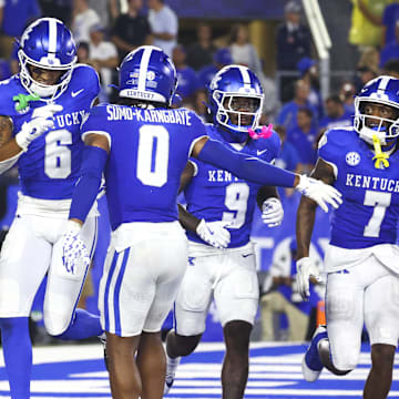 Aug 31, 2024; Lexington, Kentucky, USA; Kentucky Wildcats wide receiver Dane Key (6), running back Demie Sumo-Karngbaye (0), wide receiver Ja'Mori Maclin (9) celebrate wide receiver Barion Brown (7) touchdown during the second quarter at Kroger Field. Mandatory Credit: Carter Skaggs-Imagn Images