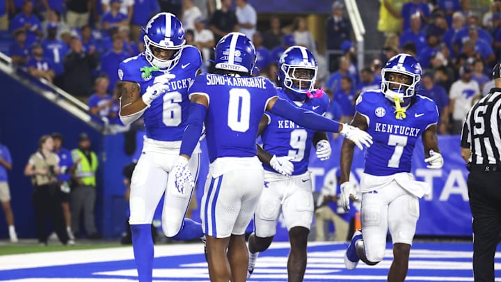 Aug 31, 2024; Lexington, Kentucky, USA; Kentucky Wildcats wide receiver Dane Key (6), running back Demie Sumo-Karngbaye (0), wide receiver Ja'Mori Maclin (9) celebrate wide receiver Barion Brown (7) touchdown during the second quarter at Kroger Field. Mandatory Credit: Carter Skaggs-Imagn Images