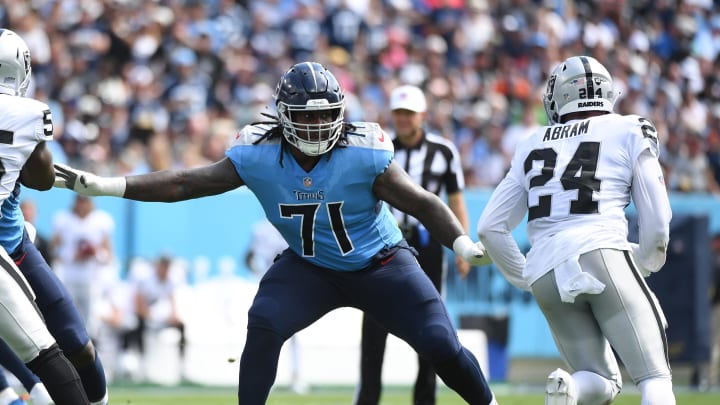 Sep 25, 2022; Nashville, Tennessee, USA; Tennessee Titans guard Dennis Daley (71) blocks against Las Vegas Raiders safety Johnathan Abram (24) during the first half at Nissan Stadium. Mandatory Credit: Christopher Hanewinckel-USA TODAY Sports