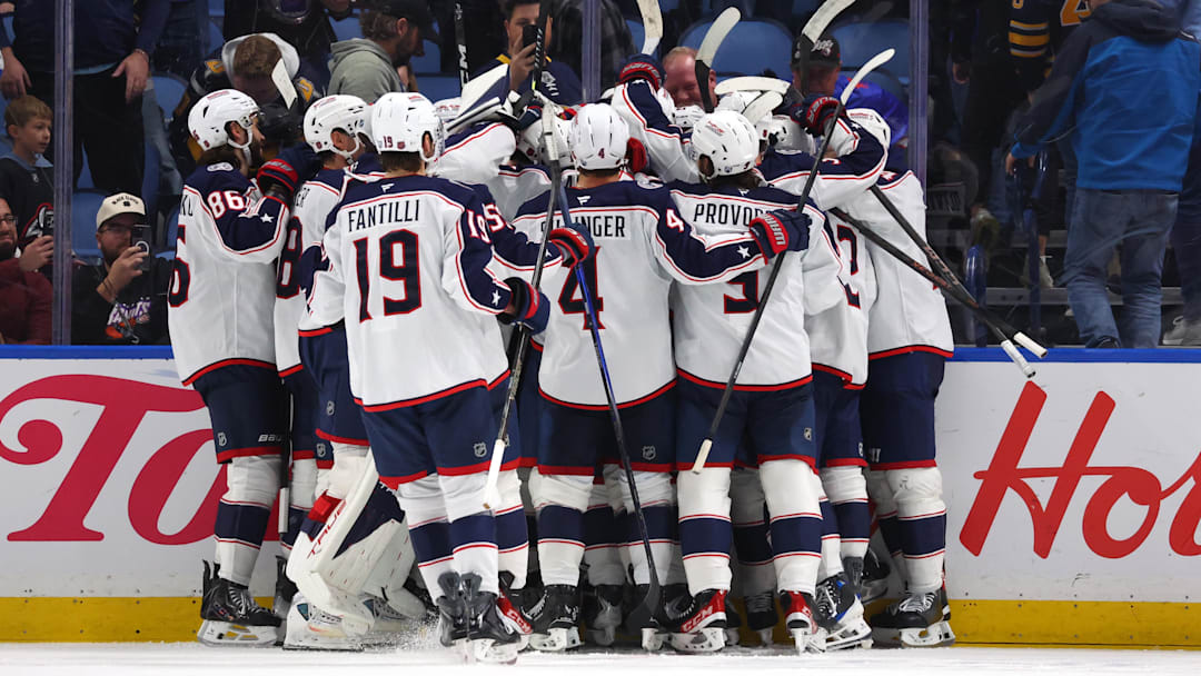 The Blue Jackets celebrate after an overtime win against the Buffalo Sabres