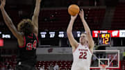 Wisconsin forward Austin Rapp (22) attempts a three-point shot over Ball State forward Preston Copeland (34) during the second half of their game Tuesday, November 11, 2025 at the Kohl Center in Madison, Wisconsin. Wisconsin beat Ball State 86-55.