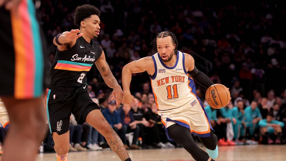 New York Knicks guard Jalen Brunson drives to the basket against San Antonio Spurs guard Dylan Harper.
