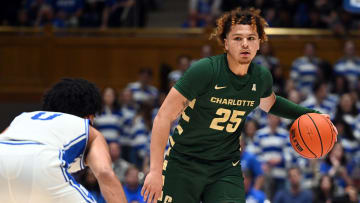 Dec 9, 2023; Durham, North Carolina, USA;  Charlotte 49ers guard Lu'Cye Patterson (25) looks to pass as Duke Blue Devils guard Jared McCain (0) defends during the first half at Cameron Indoor Stadium. Mandatory Credit: Rob Kinnan-USA TODAY Sports