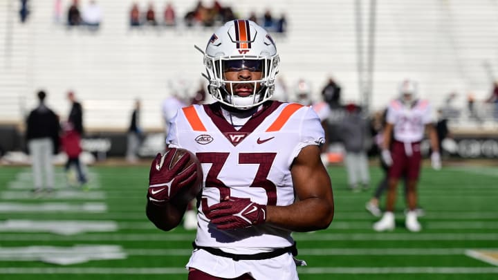 Nov 11, 2023; Chestnut Hill, Massachusetts, USA; Virginia Tech Hokies running back Bhayshul Tuten (33) warms up before a game against the Boston College Eagles at Alumni Stadium. Mandatory Credit: Eric Canha-USA TODAY Sports