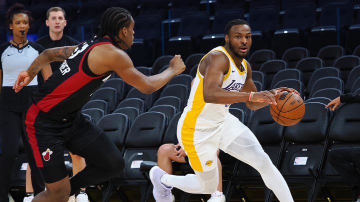 Jul 10, 2024; San Francisco, CA, USA; Los Angeles Lakers guard Bronny James Jr. (9) controls the ball against Miami Heat guard Josh Christopher (53) during the fourth quarter at Chase Center. Mandatory Credit: Kelley L Cox-USA TODAY Sports