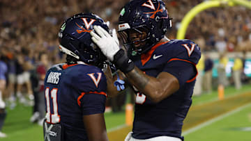Sep 26, 2025; Charlottesville, Virginia, USA; Virginia Cavaliers wide receiver Trell Harris (11) celebrates with Cavaliers tight end Dakota Twitty (9) after catches a two point conversion as Florida State Seminoles defensive back Jerry Wilson (19) defends in the second overtime period at Scott Stadium. Mandatory Credit: Geoff Burke-Imagn Images