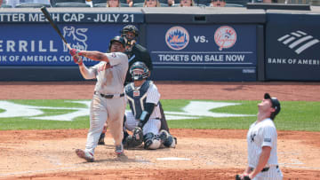 Jul 6, 2024; Bronx, New York, USA; Boston Red Sox third baseman Rafael Devers (11) hits a solo home run during the fifth inning against New York Yankees starting pitcher Gerrit Cole (45) at Yankee Stadium. Mandatory Credit: Vincent Carchietta-USA TODAY Sports