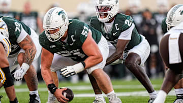 Michigan State quarterback Aidan Chiles (2) calls for a snap from offensive lineman Matt Gulbin (51) against Western Michigan during the first half at Spartan Stadium in East Lansing on Friday, August 29, 2025.