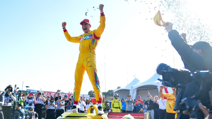 Jun 23, 2024; Salinas, California, USA; Chip Ganassi Racing driver Alex Palou (10) of Spain celebrates his victory of the Grand Prix Of Monterey at WeatherTech Raceway Laguna Seca. Mandatory Credit: Gary A. Vasquez-USA TODAY Sports