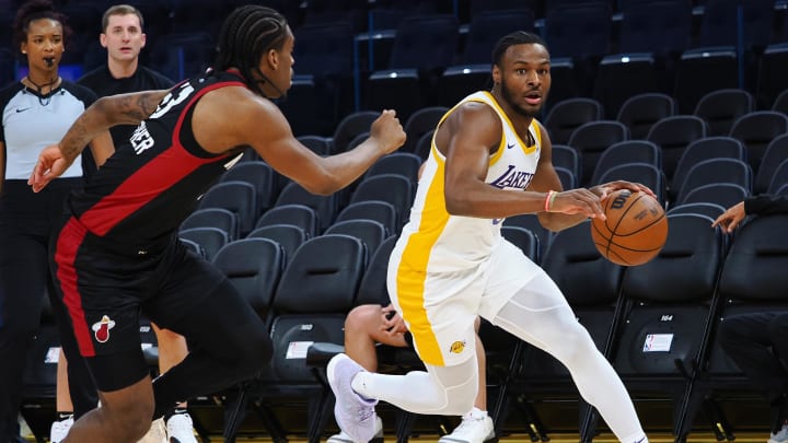 Jul 10, 2024; San Francisco, CA, USA; Los Angeles Lakers guard Bronny James Jr. (9) controls the ball against Miami Heat guard Josh Christopher (53) during the fourth quarter at Chase Center. Mandatory Credit: Kelley L Cox-USA TODAY Sports