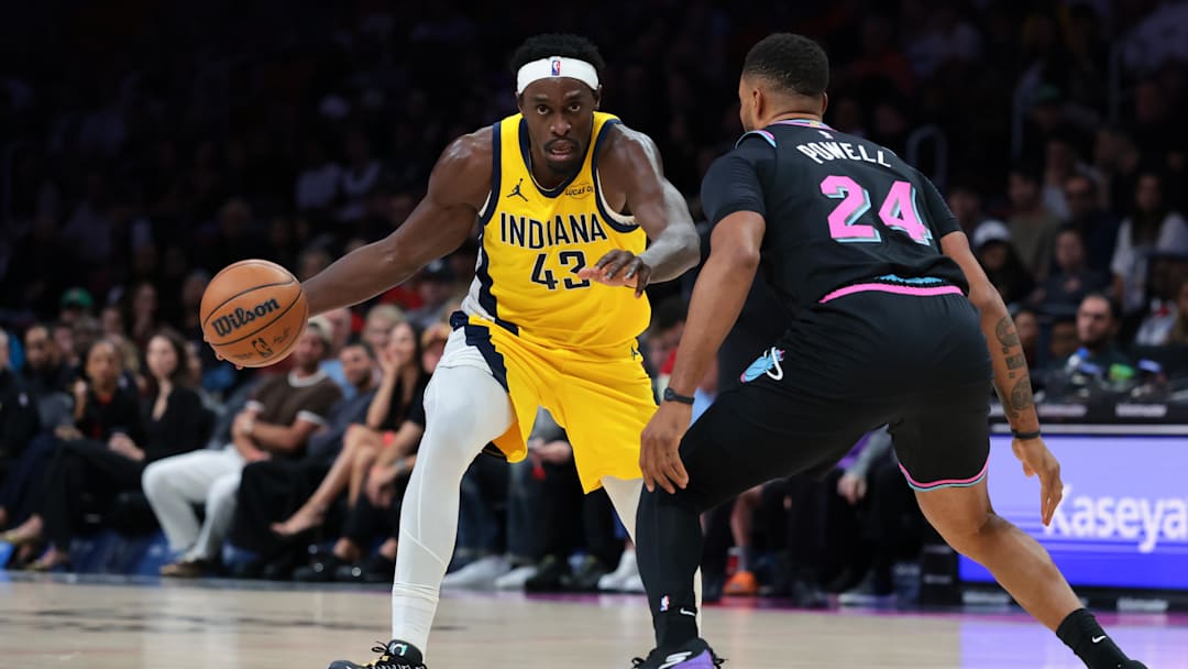 Dec 27, 2025; Miami, Florida, USA; Indiana Pacers forward Pascal Siakam (43) drives to the basket against Miami Heat guard Norman Powell (24) during the first half at Kaseya Center. Mandatory Credit: Sam Navarro-Imagn Images
