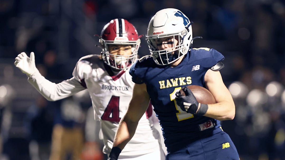 Xaverian's Dave Chiavegato scores a touchdown past Brockton's Jayden Wooten during a Div. 1 Round of 16 football game against Xaverian on Friday, Nov. 8, 2024. Xaverian's Dave Chiavegato scores a touchdown past Brockton's Jayden Wooten during a Div. 1 Round of 16 football game against Xaverian on Friday, Nov. 8, 2024.