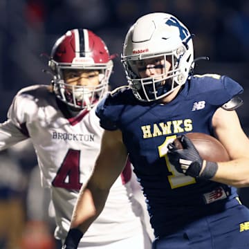 Xaverian's Dave Chiavegato scores a touchdown past Brockton's Jayden Wooten during a Div. 1 Round of 16 football game against Xaverian on Friday, Nov. 8, 2024.