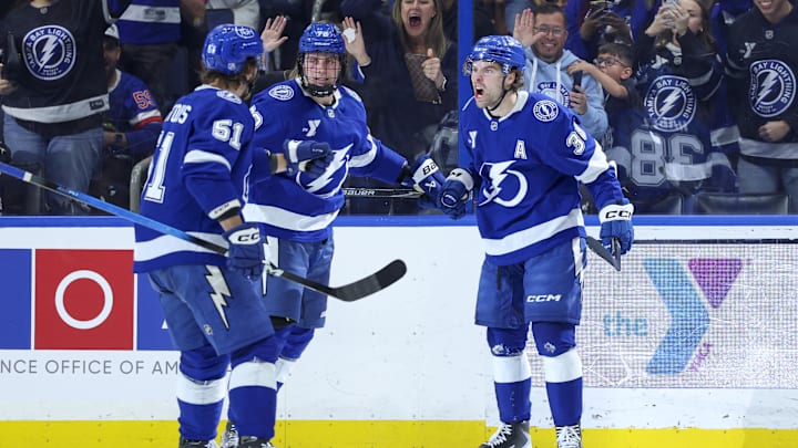 Mar 29, 2026; Tampa, Florida, USA; Tampa Bay Lightning defenseman Emil Lilleberg (78) and defenseman Charle-Edouard D'Astous (51) reacts to a goal by  left wing Brandon Hagel (38) against the Nashville Predators in the third period at Benchmark International Arena. Mandatory Credit: Nathan Ray Seebeck-Imagn Images