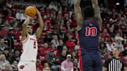 Wisconsin guard Daniel Freitag (5) shoots over Detroit Mercy guard Nate Johnson (10) during the second half of their game Sunday, December 22, 2024 at the Kohl Center in Madison, Wisconsin. Wisconsin beat Detroit Mercy 76-53.