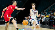 Nov 25, 2025; Las Vegas, NV, USA; Gonzaga Bulldogs guard Mario Saint-Supéry (17) passes while Maryland Terrapins guard Darius Adams (1) defends in the first half in a 2025 Players Era Festival group play game at MGM Grand Garden Arena.