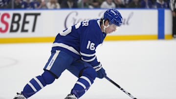 Mar 19, 2025; Toronto, Ontario, CAN; Toronto Maple Leafs forward Mitch Marner (16) carries the puck against the Colorado Avalanche during the first period at Scotiabank Arena. Mandatory Credit: John E. Sokolowski-Imagn Images