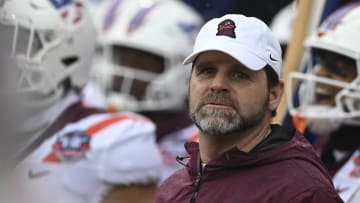 Dec 27, 2023; Annapolis, MD, USA; Virginia Tech Hokies head coach Brent Pry stands with his tea prior to being introduced before the game against the Tulane Green Wave at Navy-Marine Corps Memorial Stadium. Mandatory Credit: Tommy Gilligan-USA TODAY Sports