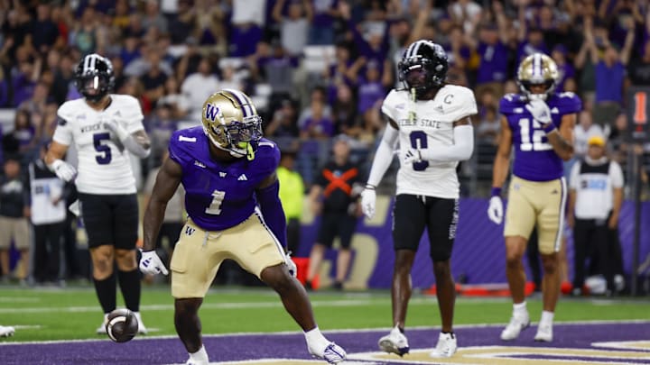 Aug 31, 2024; Seattle, Washington, USA; Washington Huskies running back Jonah Coleman (1) celebrates after rushing for a touchdown against the Weber State Wildcats during the second quarter at Alaska Airlines Field at Husky Stadium. Mandatory Credit: Joe Nicholson-Imagn Images