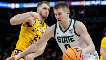 Michigan State forward Jaxon Kohler (0) dribbles against Minnesota forward Parker Fox (23) during the second half of Second Round of Big Ten tournament at Target Center in Minneapolis, Minn. on Thursday, March 14, 2024.