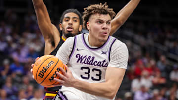 Mar 11, 2025; Kansas City, MO, USA; Kansas State Wildcats guard Coleman Hawkins (33) drives to the basket during the first half against the Arizona State Sun Devils at T-Mobile Center. 