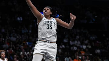 Aug 25, 2025; Brooklyn, New York, USA; New York Liberty center Jonquel Jones (35) drives to the basket against the Connecticut Sun during the first half at Barclays Center. Mandatory Credit: John Jones-Imagn Images