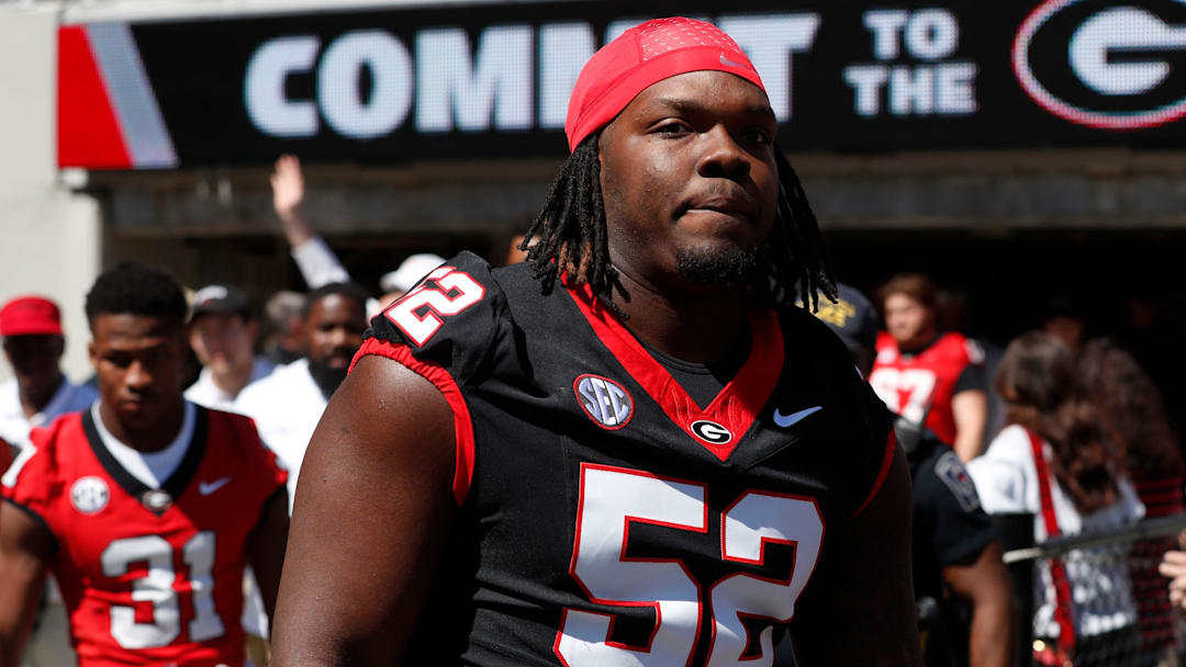 Georgia defensive lineman Christen Miller (52) arrives with the team before the start of the G-Day spring football game in Athens, Ga., on Saturday, April 13, 2024.