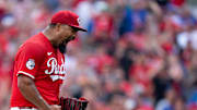 Cincinnati Reds pitcher Tony Santillan (64) reacts to striking out the last batter as the Cincinnati Reds defeat the Chicago Cubs at Great American Ball Park in Cincinnati on Sept. 21, 2025.