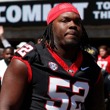 Georgia defensive lineman Christen Miller (52) arrives with the team before the start of the G-Day spring football game in Athens, Ga., on Saturday, April 13, 2024.