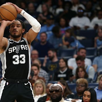 Apr 9, 2024; Memphis, Tennessee, USA; San Antonio Spurs guard Tre Jones (33) shoots for three during the second half against the Memphis Grizzlies at FedExForum. 