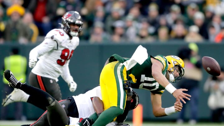 Tampa Bay Buccaneers linebacker Lavonte David (54) and linebacker Shaquil Barrett (7) sack Green Bay Packers quarterback Jordan Love (10) causing a fumble late in the fourth quarter during their football game on Sunday, December 17, 2023, at Lambeau Field in Green Bay Wis. Tampa Bay defeated Green Bay 34-20.