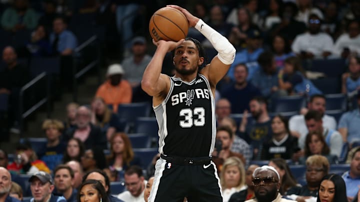 Apr 9, 2024; Memphis, Tennessee, USA; San Antonio Spurs guard Tre Jones (33) shoots for three during the second half against the Memphis Grizzlies at FedExForum. 