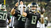 Oregon quarterback Dillon Gabriel dances to celebrate a touchdown.