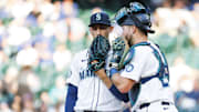 Seattle Mariners pitcher George Kirby (left) talks with catcher Cal Raleigh on the mound during a game against the Baltimore Orioles on June 3 at T-Mobile Park.