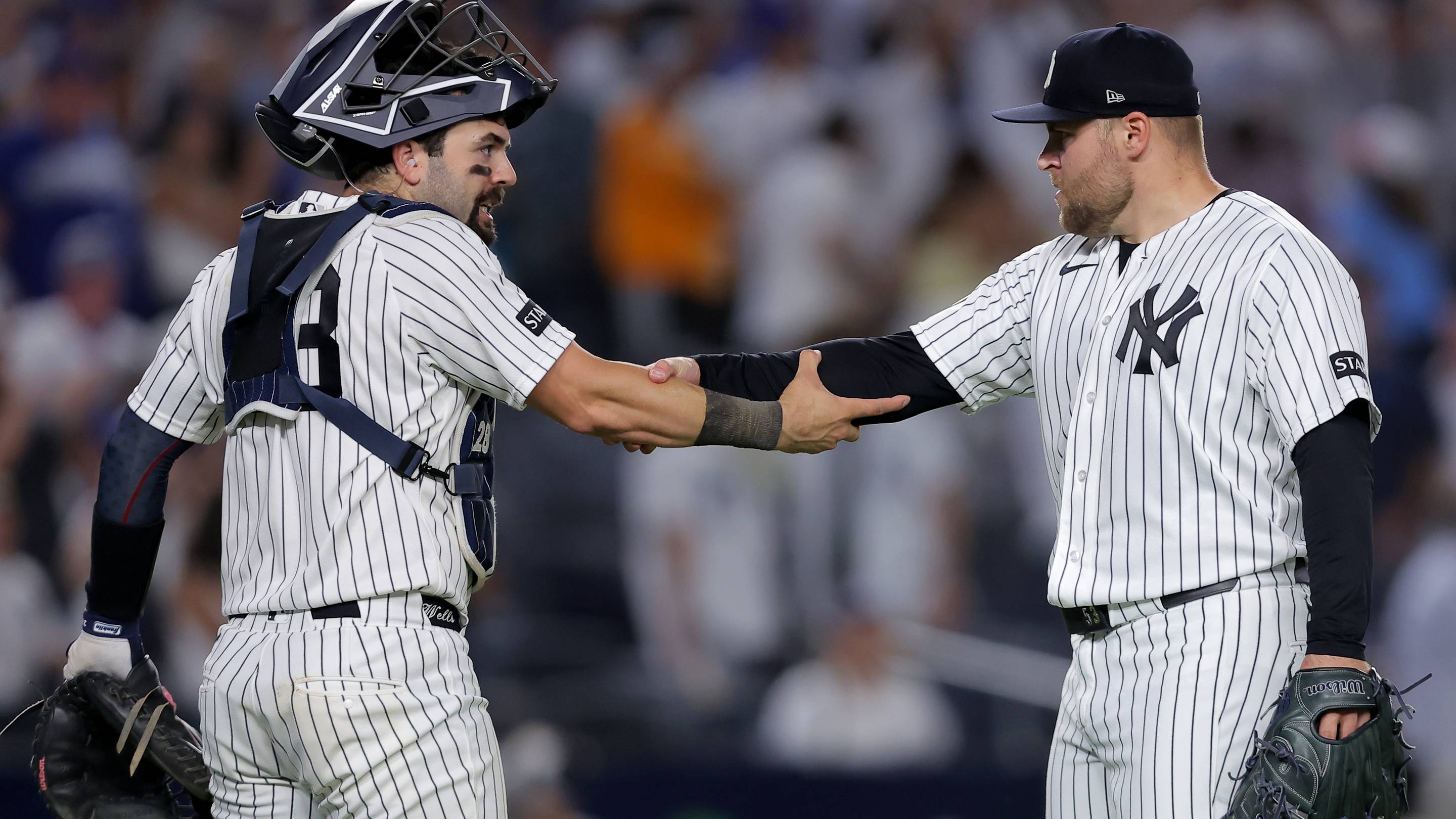 Jul 19, 2026; Bronx, New York, USA; New York Yankees catcher Austin Wells (28) and relief pitcher David Bednar (53) celebrate after defeating the Los Angeles Dodgers at Yankee Stadium. Mandatory Credit: Brad Penner-Imagn Images
