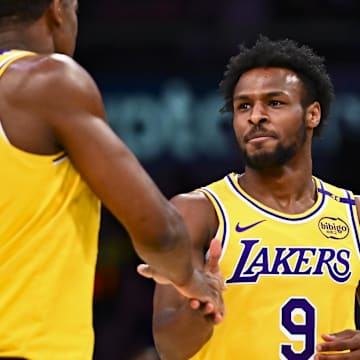 Apr 11, 2025; Los Angeles, California, USA; Los Angeles Lakers guard Bronny James Jr. (9) celebrates with center Trey Jemison III (55) after scoring against the Houston Rockets during the second half at Crypto.com Arena. Mandatory Credit: Jonathan Hui-Imagn Images