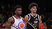 Apr 1, 2025; Brooklyn, NY, USA; McDonald's All American West guard Darryn Peterson (22) and McDonald's All American East forward Cameron Boozer (12) pose for photos after the game at Barclays Center. Mandatory Credit: Pamela Smith-Imagn Images