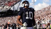 Penn State Nittany Lions running back Nicholas Singleton celebrates after scoring a touchdown against the Indiana Hoosiers.