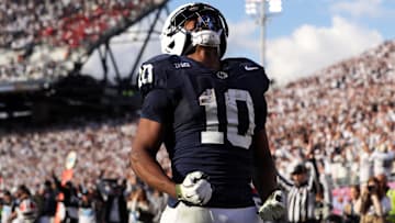 Penn State Nittany Lions running back Nicholas Singleton celebrates after scoring a touchdown against the Indiana Hoosiers.