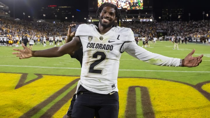 Colorado quarterback Shedeur Sanders celebrates after defeating the Arizona State Sun Devils at Mountain America Stadium in October.