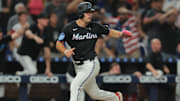 Aug 1, 2025; Miami, Florida, USA; Miami Marlins center fielder Jakob Marsee (87) scores against the New York Yankees during the ninth inning at loanDepot Park. Mandatory Credit: Sam Navarro-Imagn Images