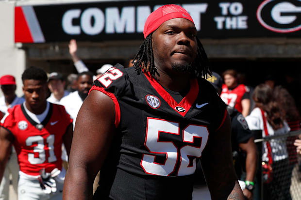 Georgia DT Christen Miller arrives with the team before the start of the G-Day spring football game in Athens, GA. Georgia DT Christen Miller arrives with the team before the start of the G-Day spring football game in Athens, GA.