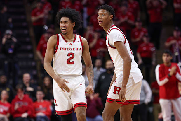 Rutgers Scarlet Knights guard Dylan Harper (2) celebrates in front of guard Ace Bailey (4) during the second half against the