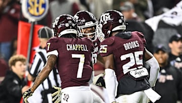 Nov 11, 2023; College Station, Texas, USA; Texas A&M Aggies defensive lineman Fadil Diggs (10), defensive back Tyreek Chappell (7) and Texas A&M Aggies defensive back Dalton Brooks (25) react during the game against the Mississippi State Bulldogs at Kyle Field. Mandatory Credit: Maria Lysaker-Imagn Images