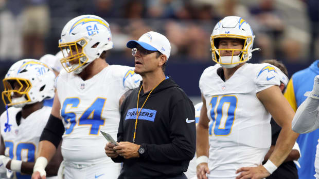 Aug 24, 2024; Arlington, Texas, USA; Los Angeles Chargers head coach Jim Harbaugh stands on the field before the game against