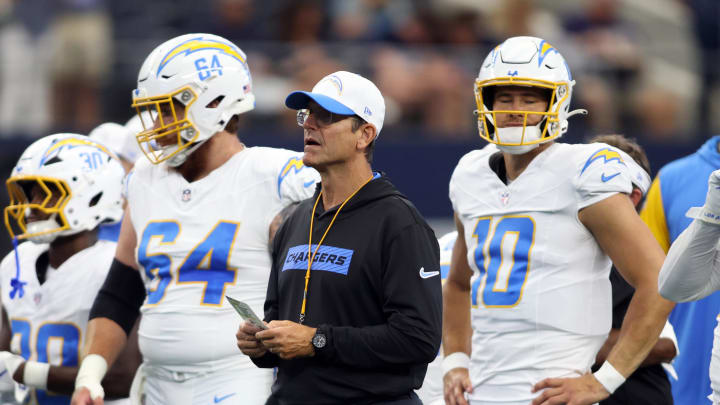 Aug 24, 2024; Arlington, Texas, USA; Los Angeles Chargers head coach Jim Harbaugh stands on the field before the game against the Dallas Cowboys at AT&T Stadium. Mandatory Credit: Tim Heitman-USA TODAY Sports