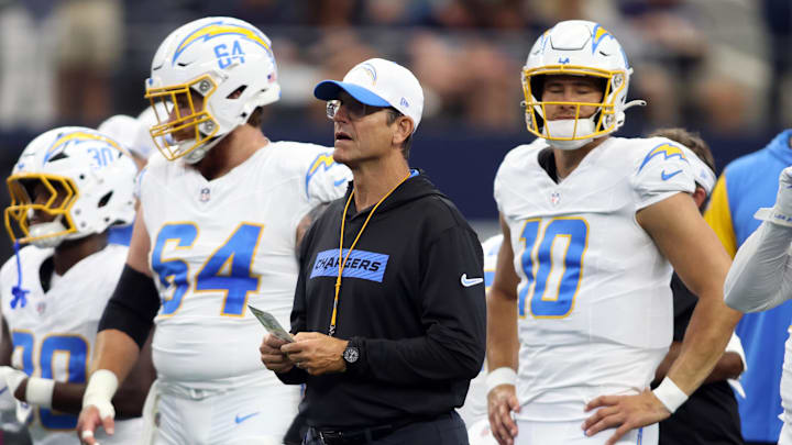 Aug 24, 2024; Arlington, Texas, USA; Los Angeles Chargers head coach Jim Harbaugh stands on the field before the game against the Dallas Cowboys at AT&T Stadium. Mandatory Credit: Tim Heitman-Imagn Images