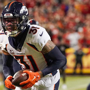 Oct 12, 2023; Kansas City, Missouri, USA; Denver Broncos safety Justin Simmons (31) runs the ball against the Kansas City Chiefs during the game at GEHA Field at Arrowhead Stadium. 